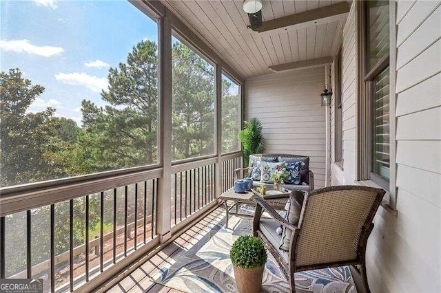 sunroom / solarium with wooden ceiling and vaulted ceiling