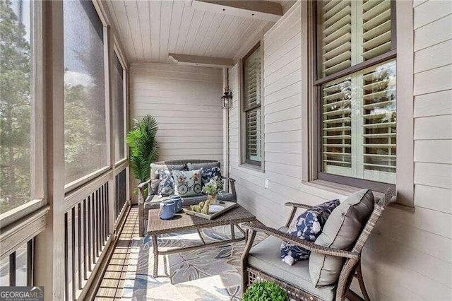 sunroom / solarium featuring wooden ceiling