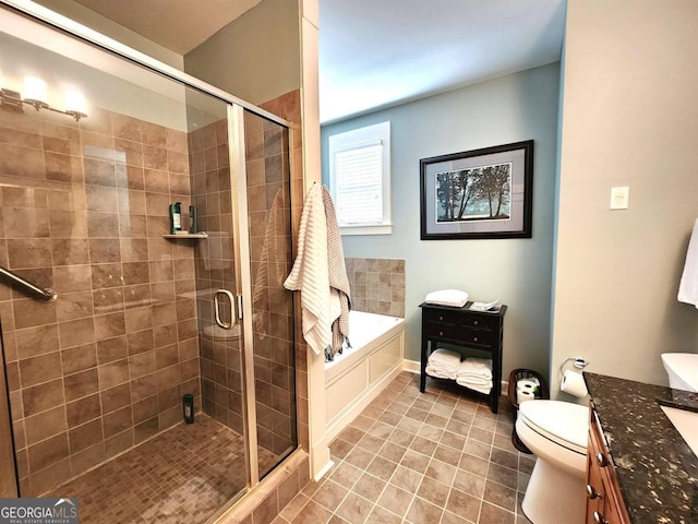 full bathroom with vanity, independent shower and bath, and toilet