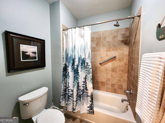 full bathroom with shower / bath combo with shower curtain and toilet