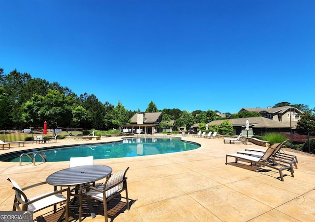 view of pool featuring a patio