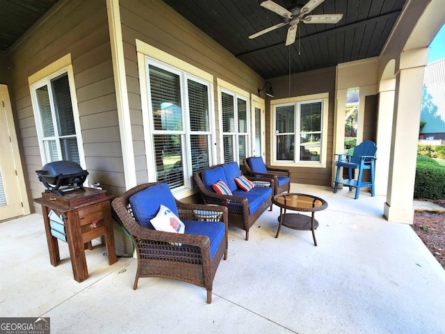 view of patio / terrace featuring a grill, an outdoor living space with a fire pit, and ceiling fan