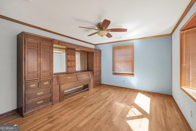 unfurnished bedroom with ceiling fan, light wood-type flooring, and crown molding