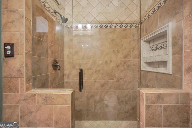 bathroom featuring an enclosed shower