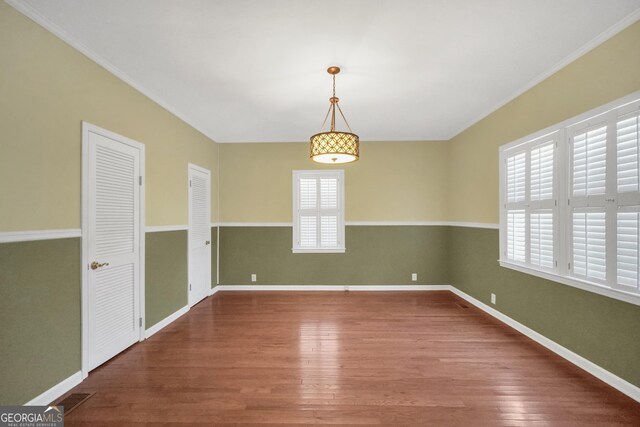 unfurnished room with hardwood / wood-style floors