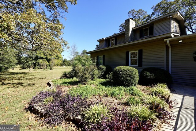 view of home's exterior featuring a lawn