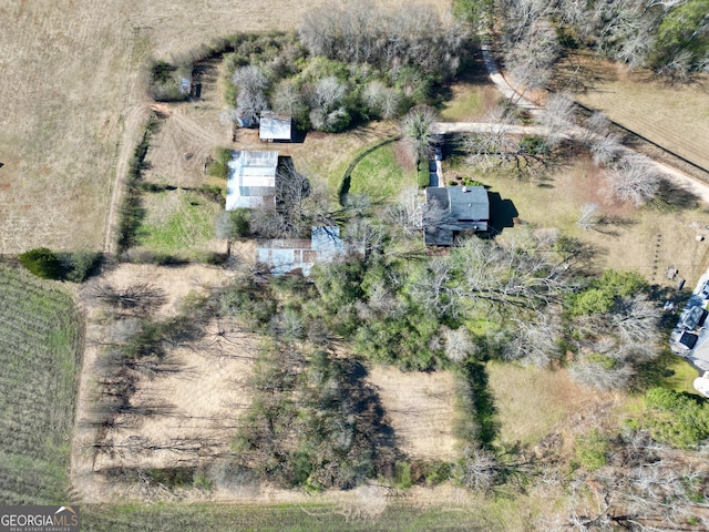 birds eye view of property with a rural view