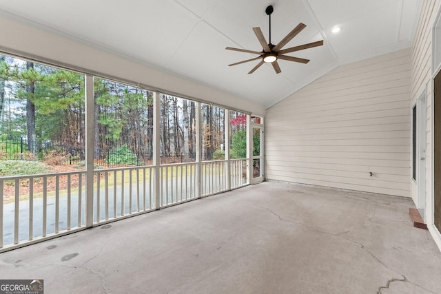 unfurnished sunroom featuring ceiling fan and lofted ceiling