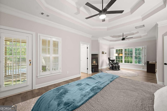 bedroom featuring access to outside, multiple windows, crown molding, and dark hardwood / wood-style floors