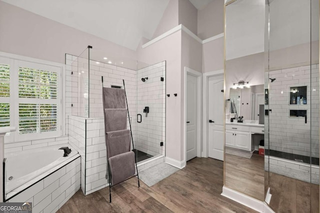 bathroom featuring vanity and plus walk in shower