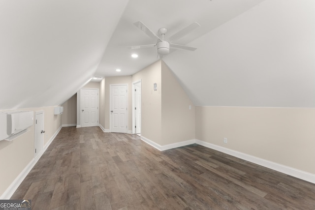 additional living space featuring vaulted ceiling, ceiling fan, and dark wood-type flooring