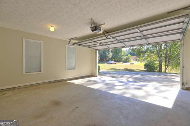 garage with a carport and a garage door opener