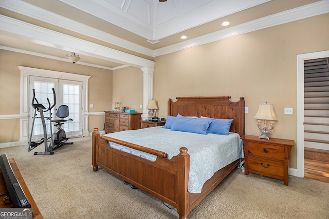 carpeted bedroom with ornamental molding and decorative columns