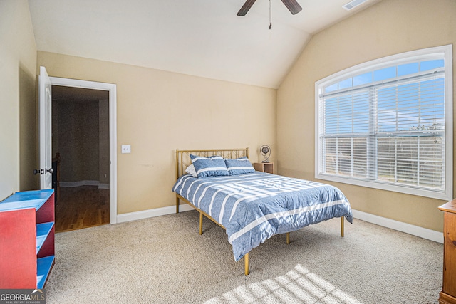 bedroom with carpet floors, vaulted ceiling, and ceiling fan