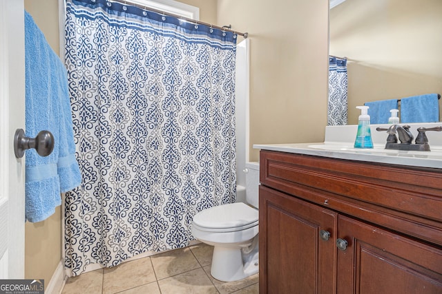 bathroom featuring vanity, toilet, tile patterned flooring, and a shower with shower curtain