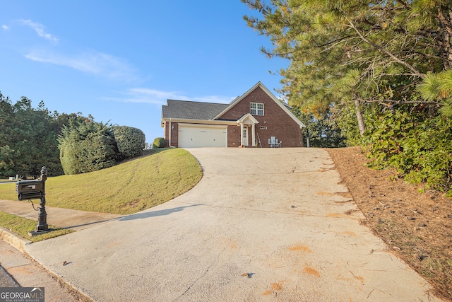 view of front of home featuring a front yard and a garage