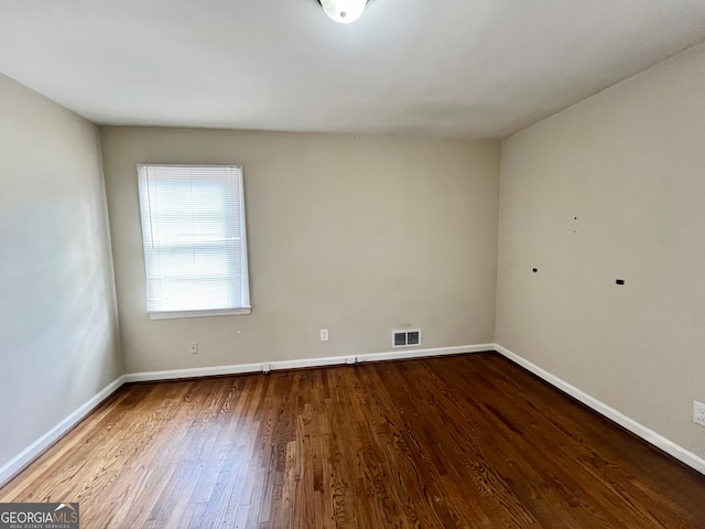 empty room featuring hardwood / wood-style flooring