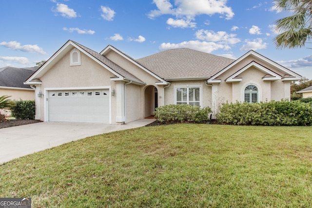 ranch-style home with a front lawn and a garage