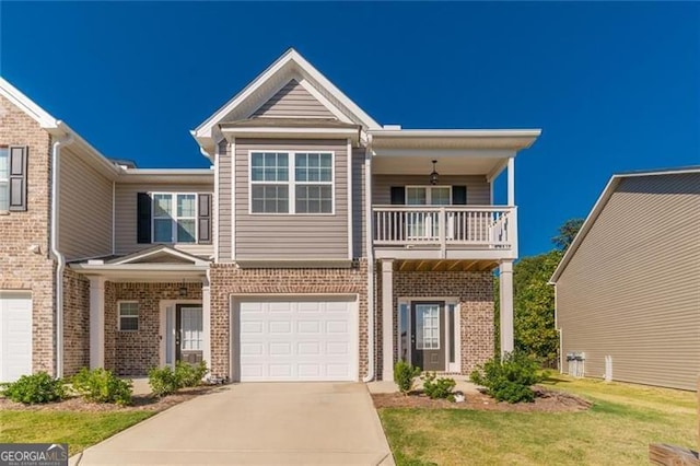 view of front of home with a balcony, a garage, and a front lawn