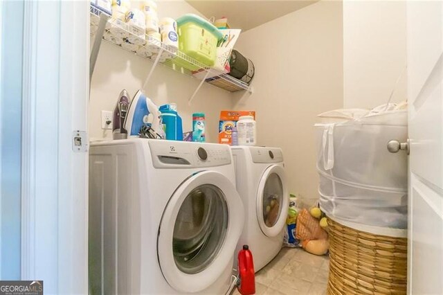 washroom featuring independent washer and dryer