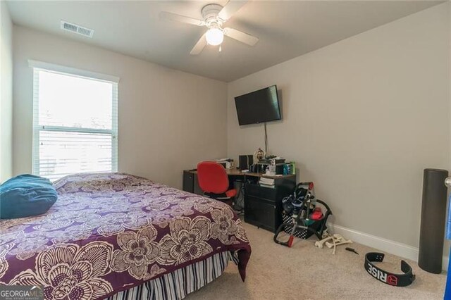 bedroom featuring ceiling fan and carpet floors