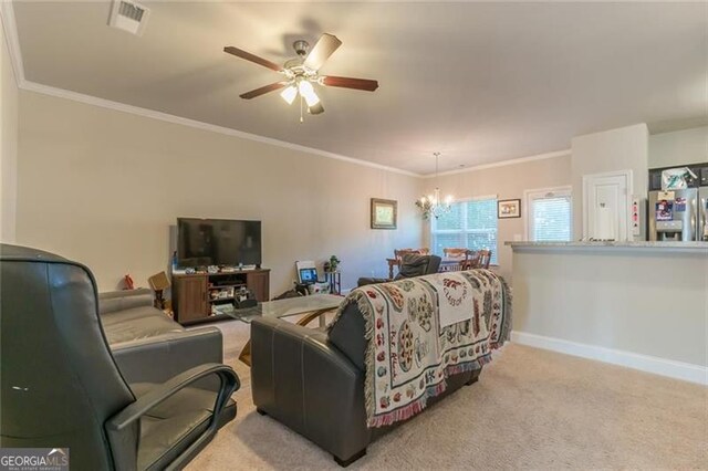 living room with crown molding, light colored carpet, and ceiling fan with notable chandelier