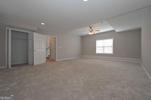 unfurnished bedroom featuring ceiling fan and light colored carpet