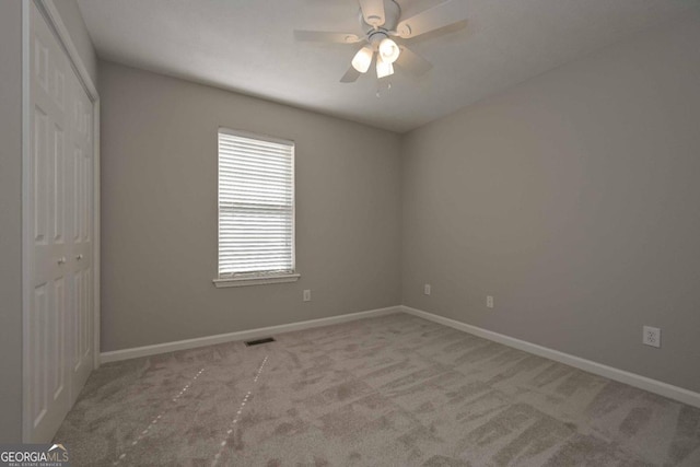 interior space with ceiling fan