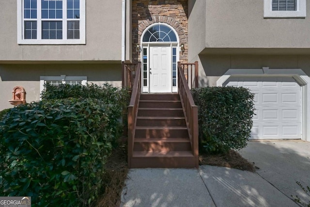 entrance to property featuring a garage