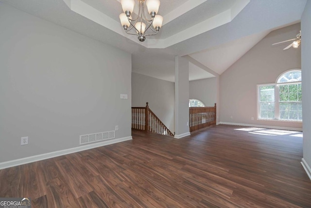 interior space featuring a chandelier, vaulted ceiling, and dark hardwood / wood-style floors