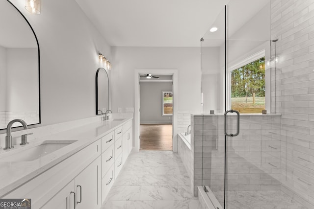 bathroom featuring shower with separate bathtub, vanity, plenty of natural light, and ceiling fan