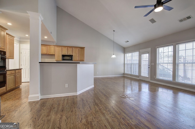 unfurnished living room featuring ornate columns, ceiling fan, dark hardwood / wood-style flooring, and high vaulted ceiling