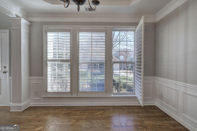 interior space with wood-type flooring, decorative columns, and crown molding