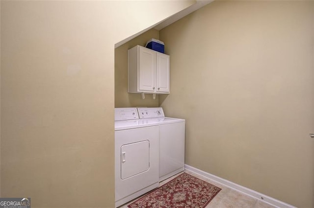 laundry room featuring cabinets and independent washer and dryer