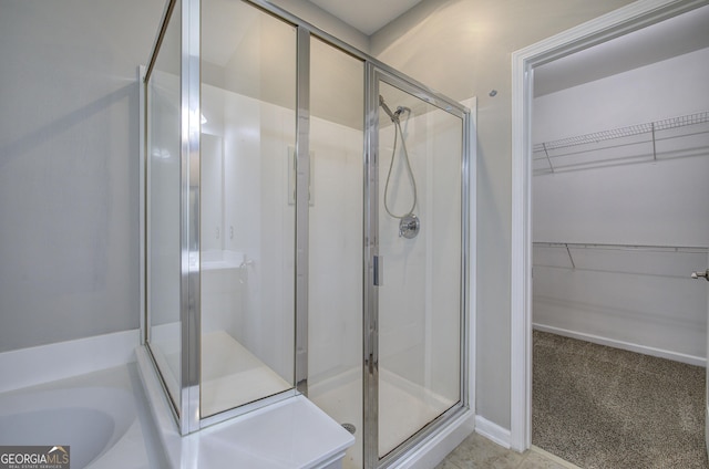 bathroom featuring plus walk in shower