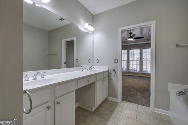 bathroom with tile patterned floors, ceiling fan, and vanity