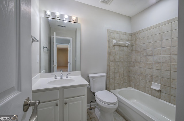 full bathroom with tile patterned floors, vanity, toilet, and tiled shower / bath combo