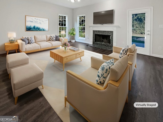 living room with dark hardwood / wood-style flooring and a fireplace