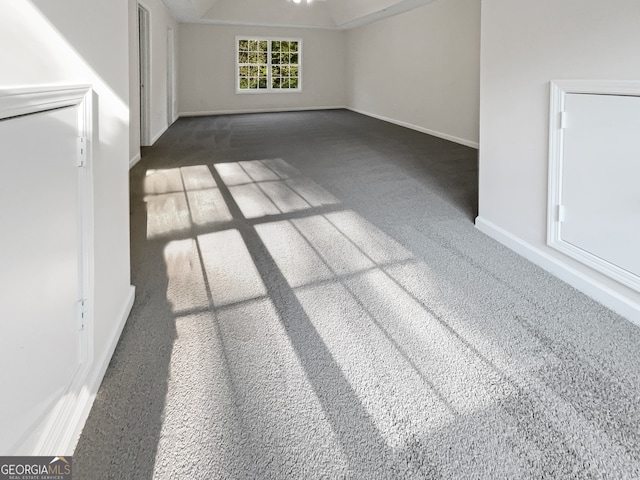 interior space featuring dark colored carpet