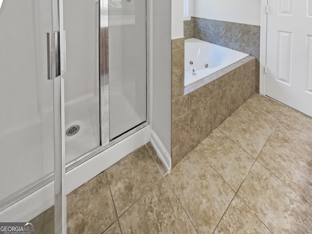 bathroom featuring separate shower and tub and tile patterned flooring