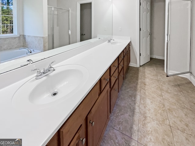 bathroom featuring vanity, shower with separate bathtub, and tile patterned flooring