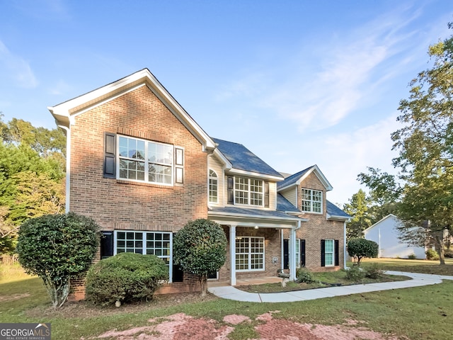 view of front of home with a front yard