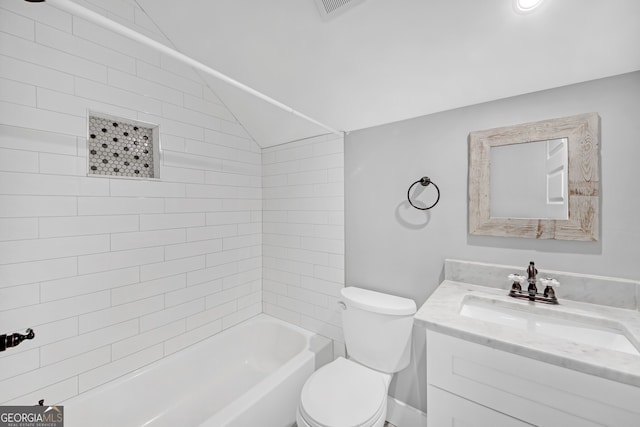 full bathroom featuring vanity, lofted ceiling, tiled shower / bath combo, and toilet