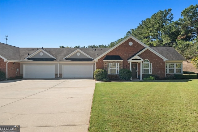 single story home with a front yard and a garage