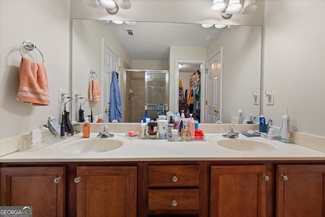 bathroom featuring vanity and walk in shower