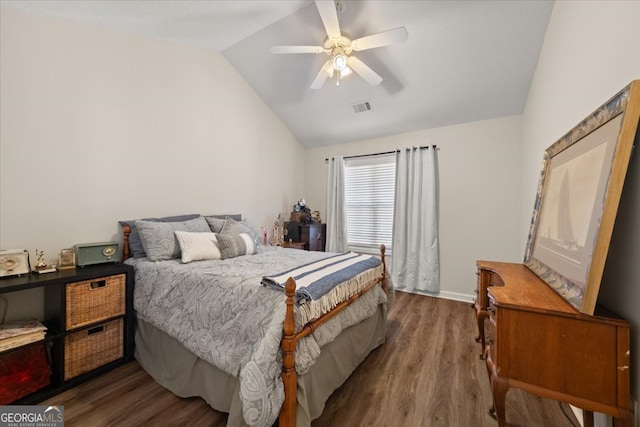 bedroom with lofted ceiling, ceiling fan, and dark hardwood / wood-style flooring