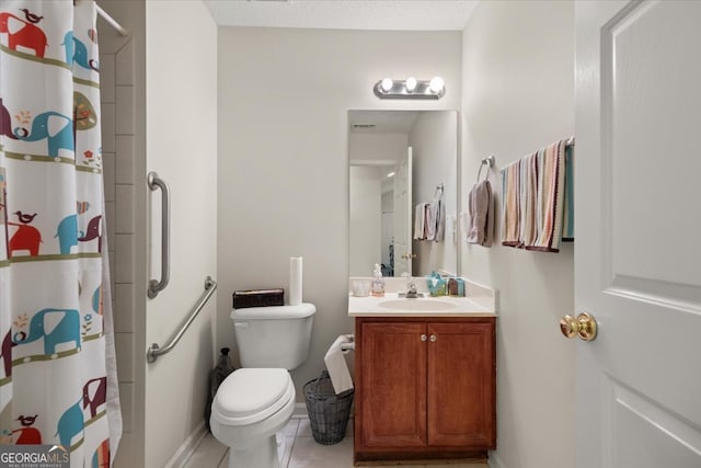 bathroom featuring toilet, curtained shower, vanity, and tile patterned floors