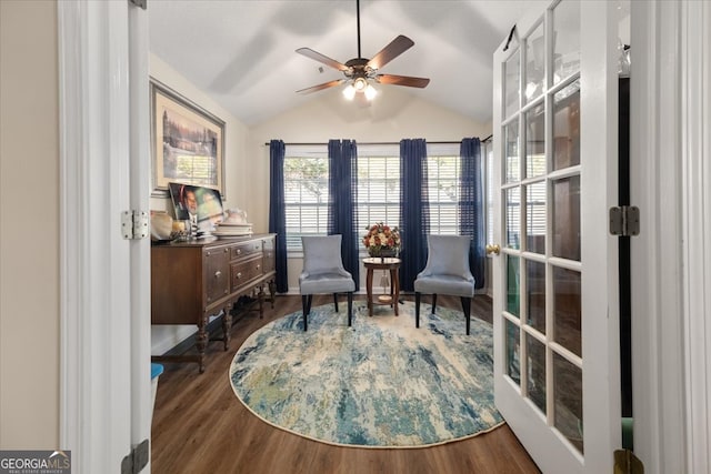 living area with lofted ceiling, dark wood-type flooring, french doors, and ceiling fan