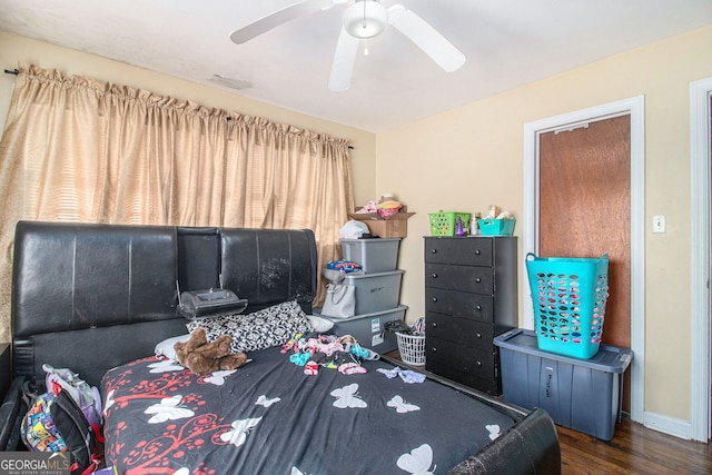 bedroom featuring dark wood-type flooring and ceiling fan