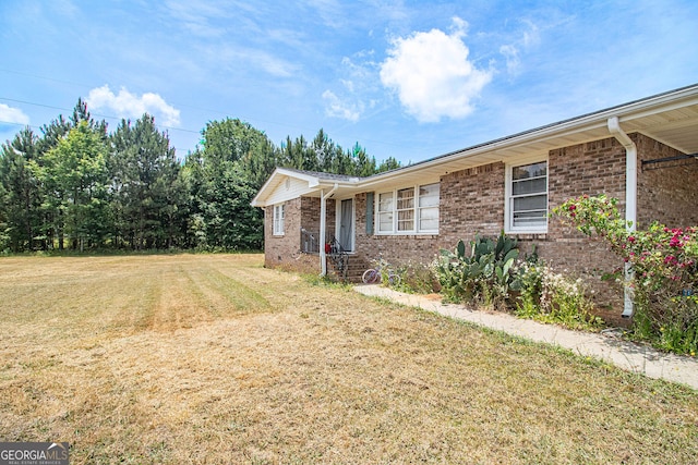 ranch-style home featuring a front yard